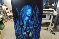 Cool blue flames frame a ghostly woman on this full size Admiral fridge